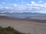 Beautiful Tranquil Panorama View from Famous Snowdonia at National Parks in Wales on a Cloudy Sky Above.