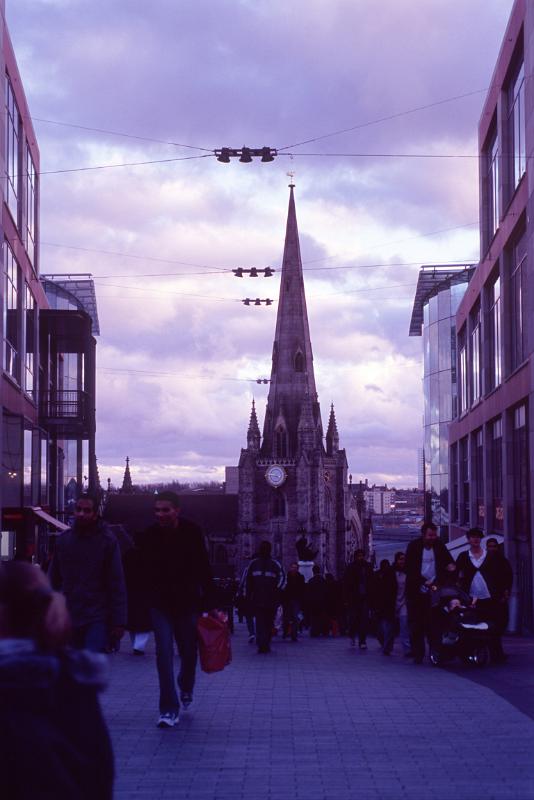 St Martin Church and City Shop Buildings in England, Captured with Random People Passing By