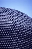 Exterior of the new Bullring Shopping Centre, Birmingham with its distinctive curved architectural design against a blue sky