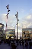 Random Shoppers at Shopping Precinct with Elegant Architectural Business Buildings in Birmingham.