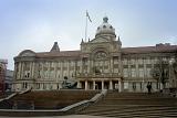 Exterior architecture and steps leading up to the historical Birmingham, England, town hall on a sunny blue sky day