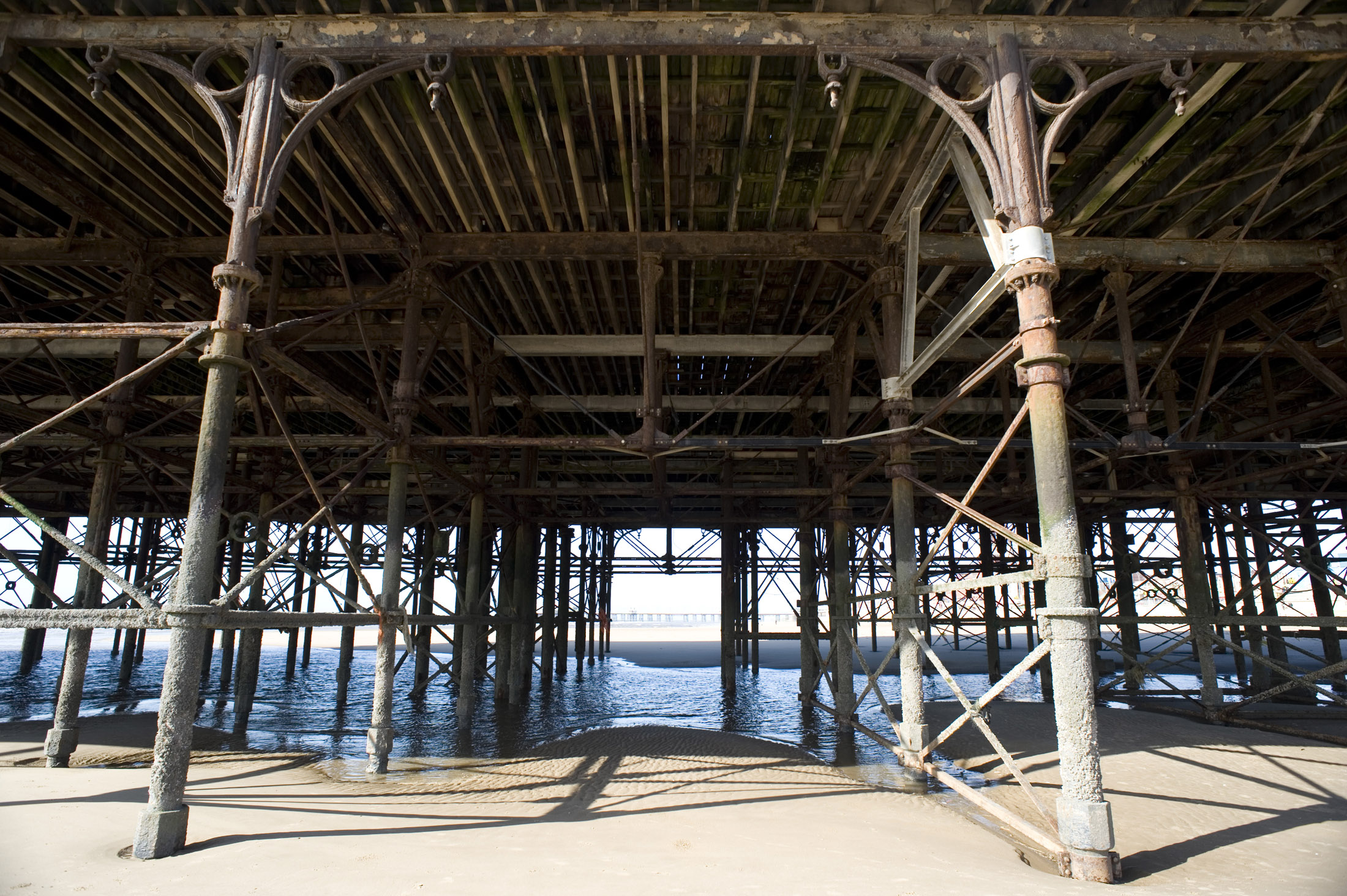 an image of metal supports underneath blackpools central pier