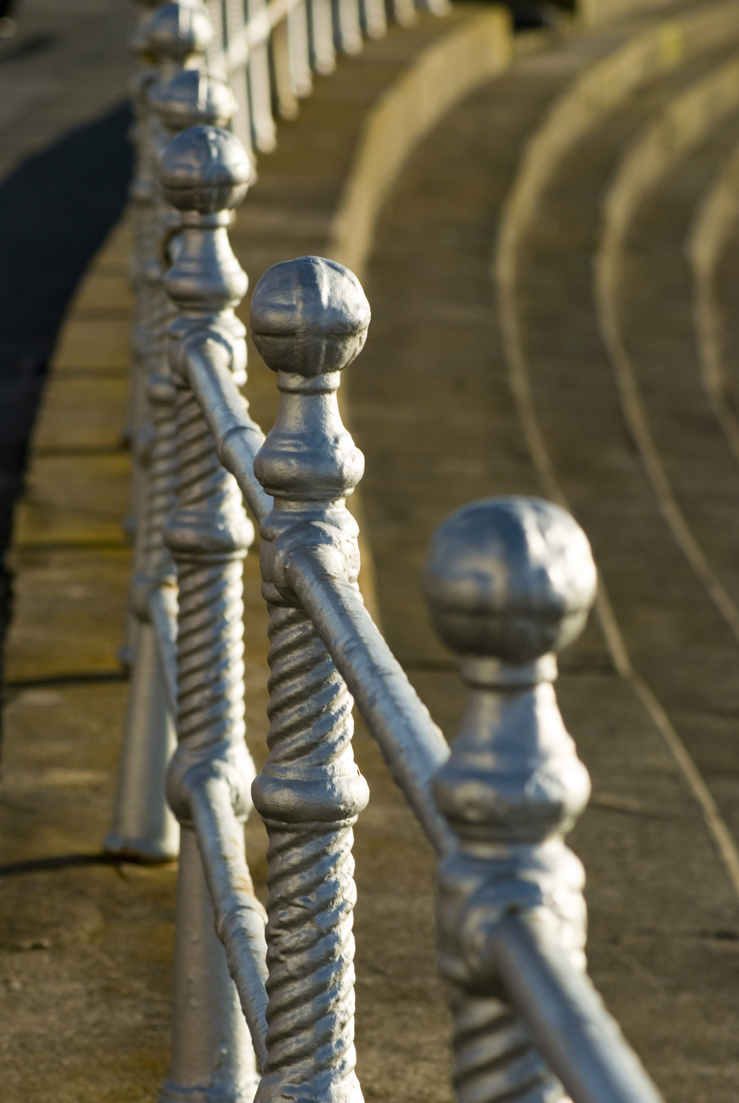 an image of silver painted historic iron railings on the side of blackpool prom
