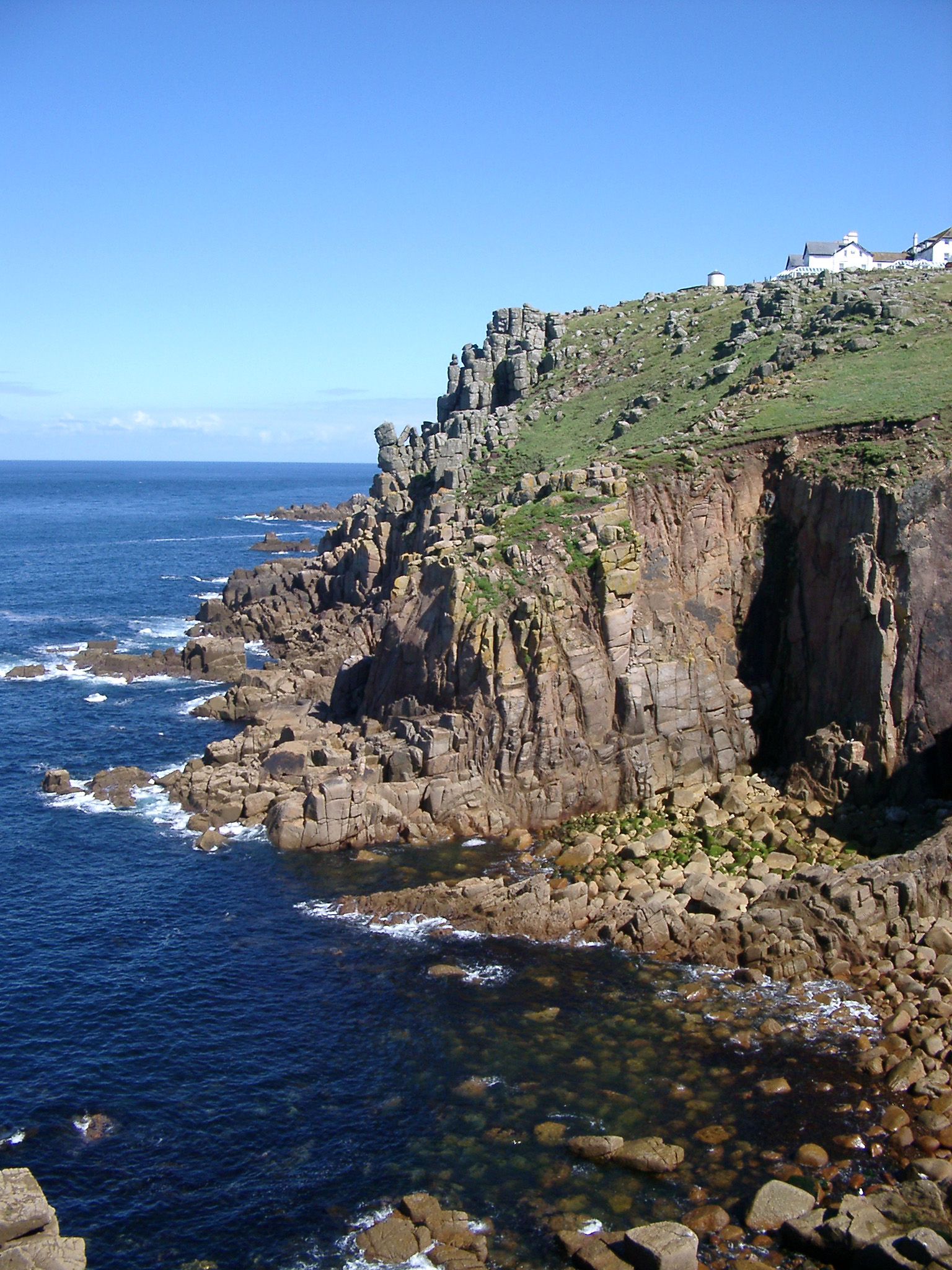 an image of cliffs and visitor centre at lands end, cornwall