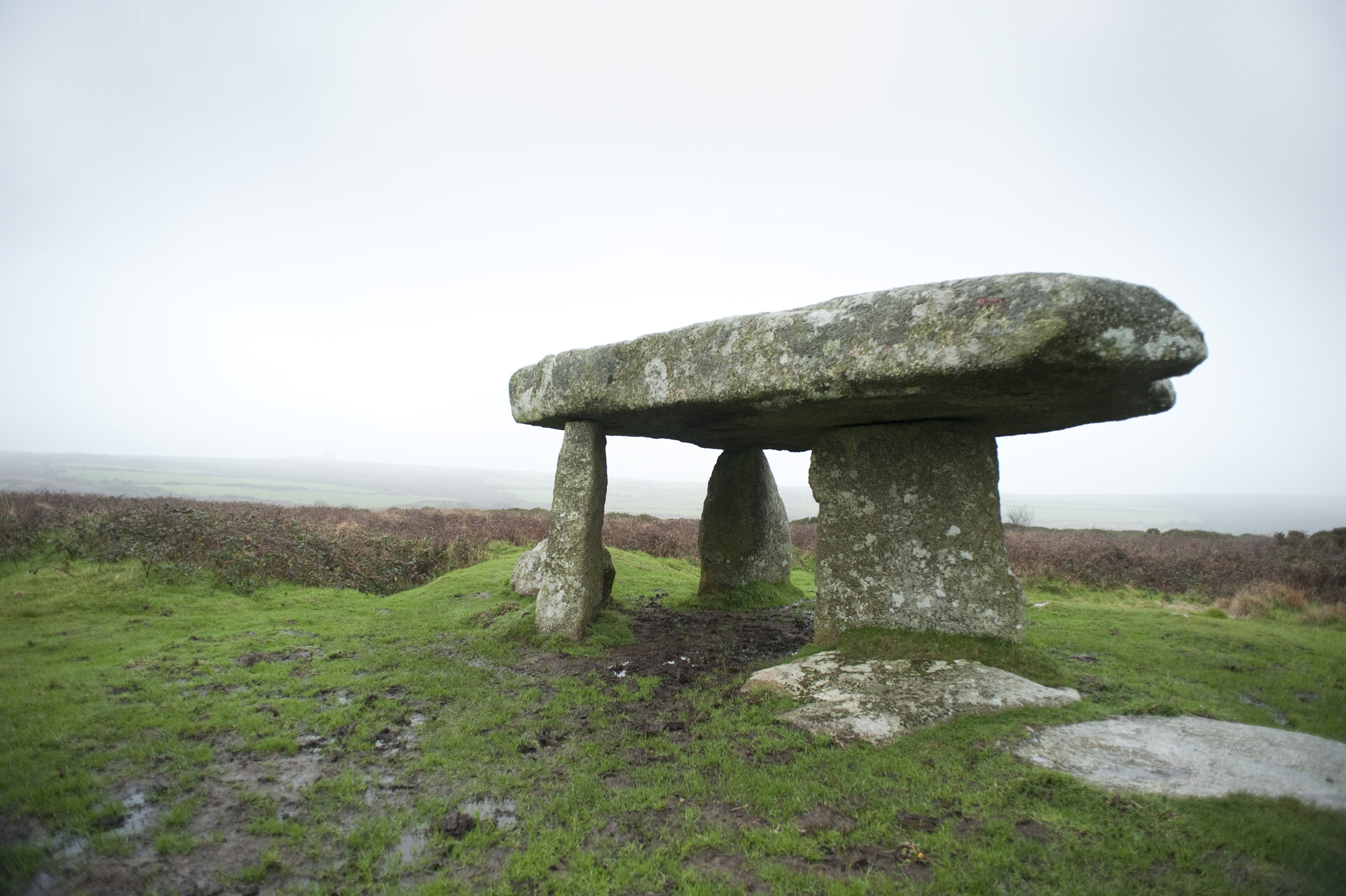 an image of Lanyon Quoit is a dolmen or tomb of standing stones near Morvah, Cornwall