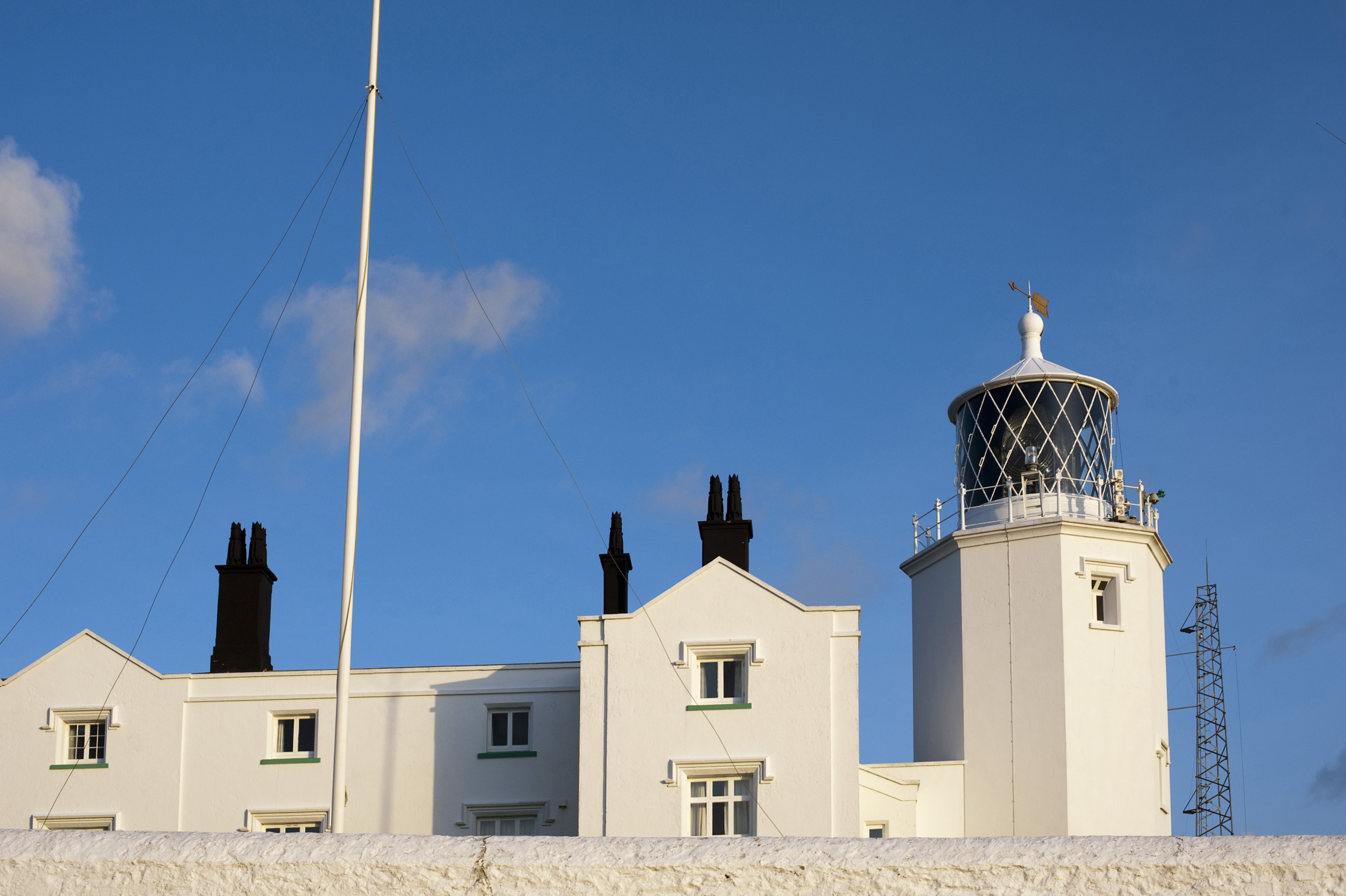 an image of White painted light house on Lizard Point, Englands most southerly point