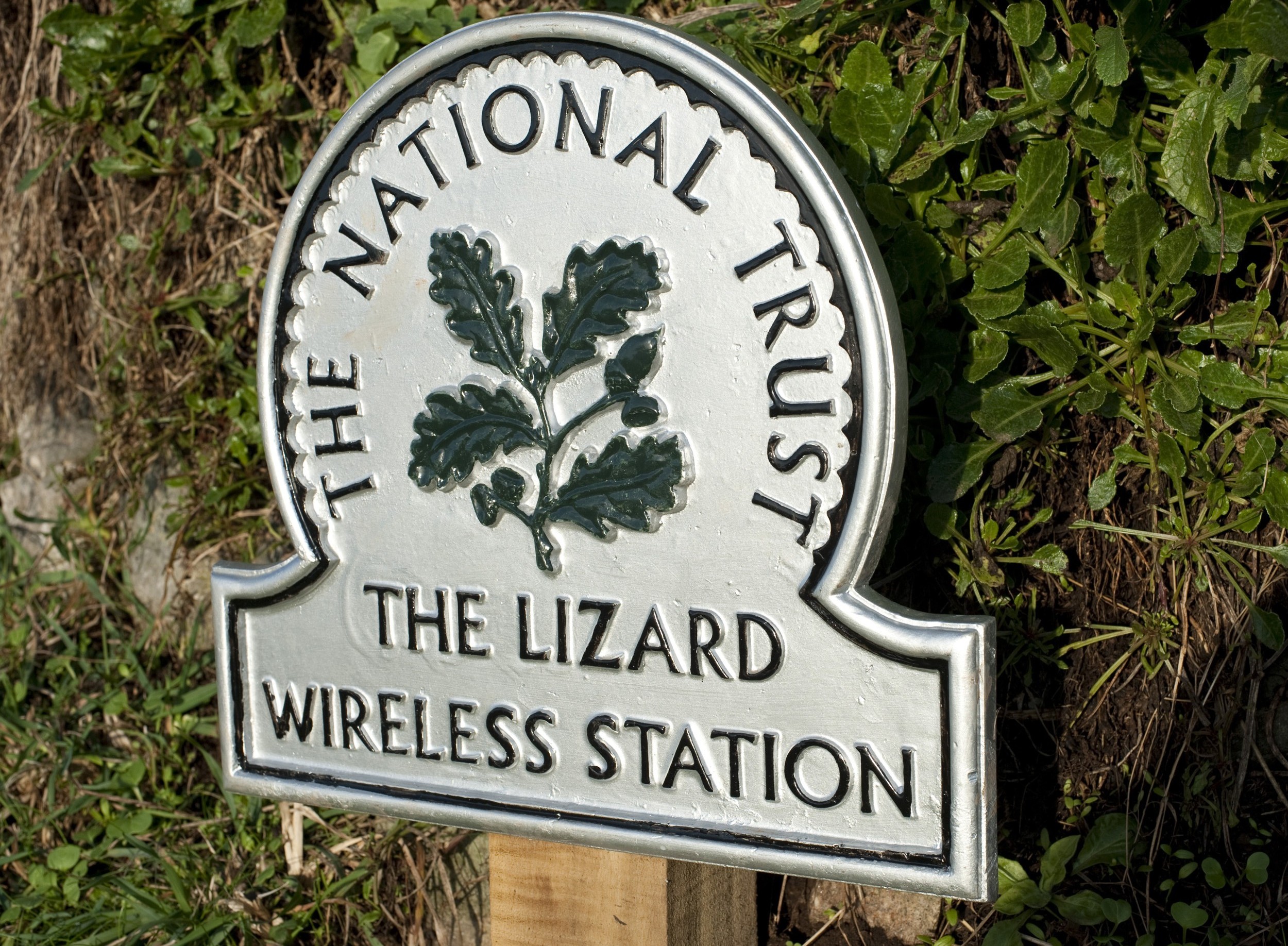 an image of National trust sign marking the historic Lizard Wireless Station