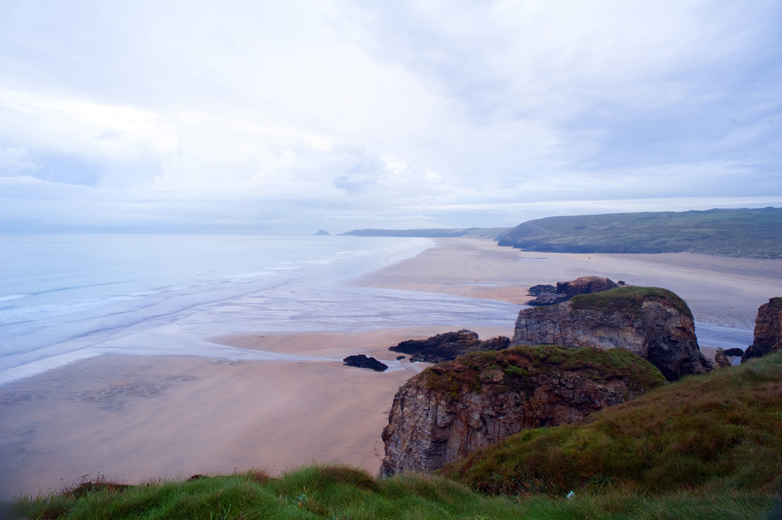 an image of miles of empty sand, dusk at parrenporth beach, cornwall