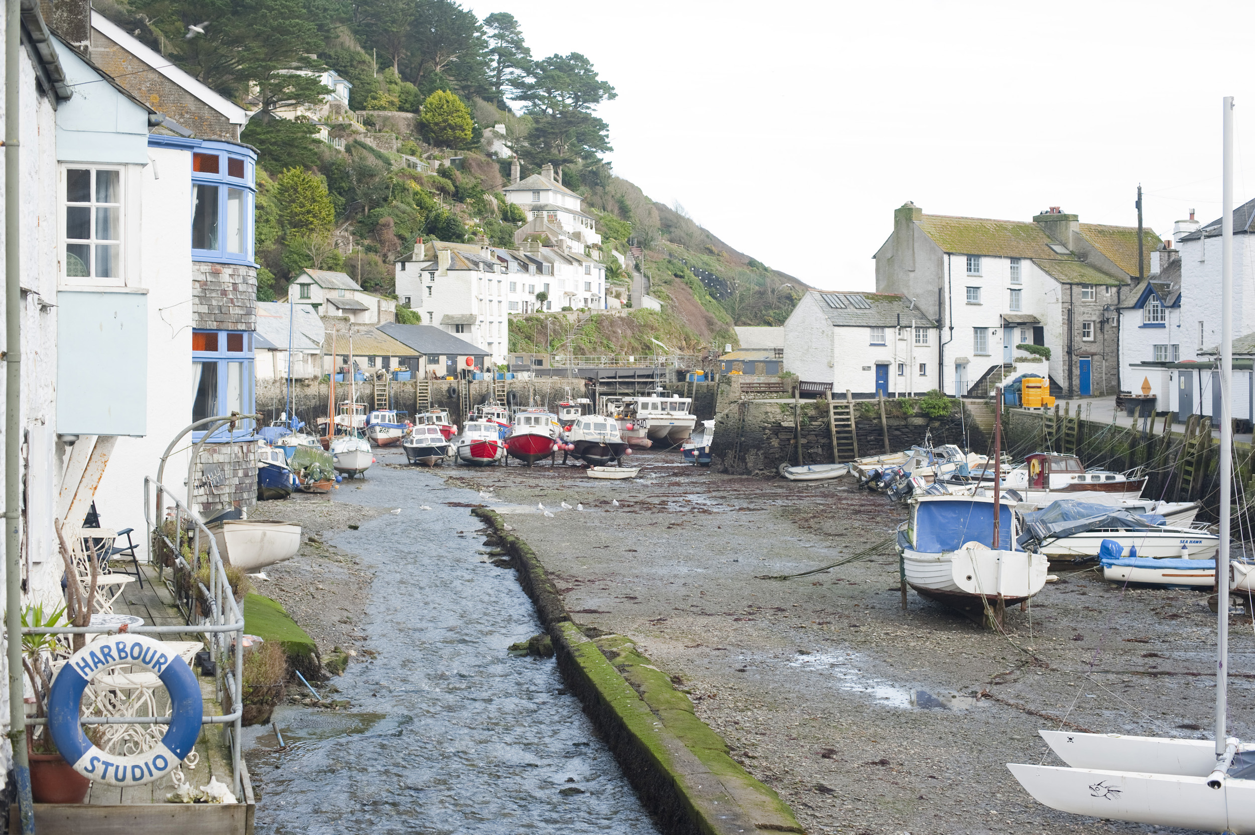 an image of a view of polperro harbour at low tide