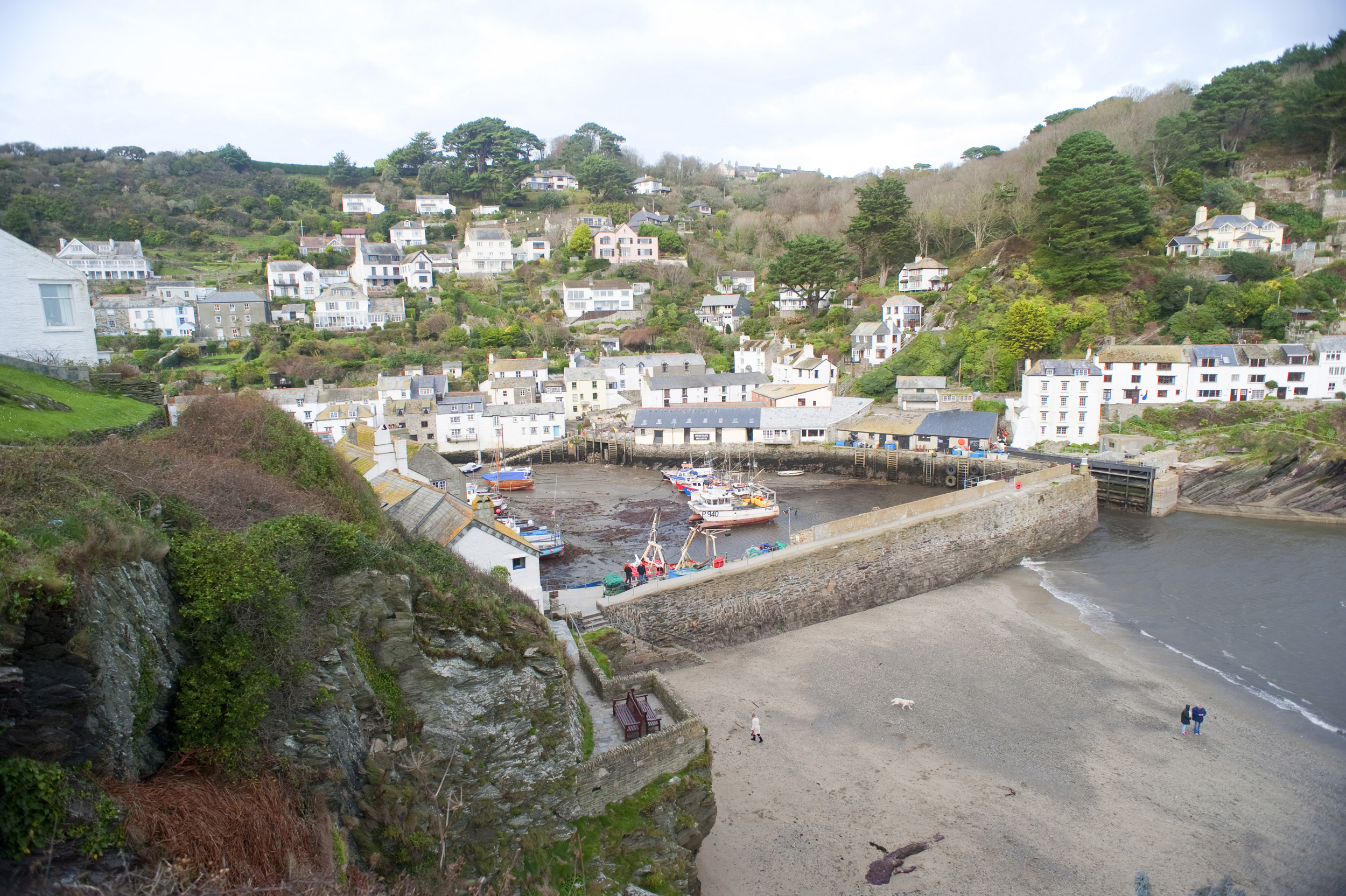 an image of shelterd harbour at polperro, cornwall