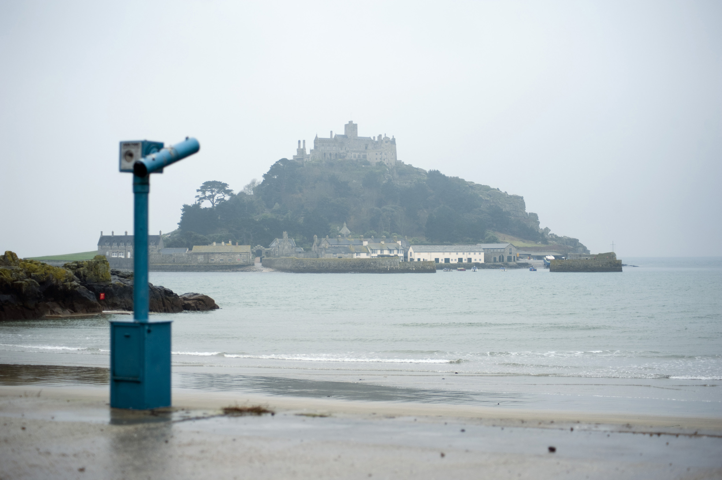 an image of a rainy day view looking out to sea towards st michaels mount and monastery