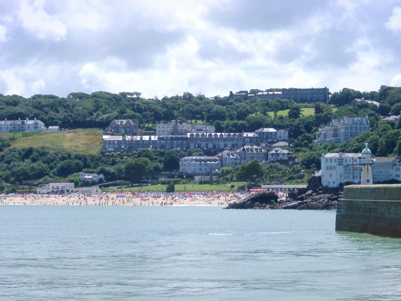 beach and harbour wall at st ives, cornwall