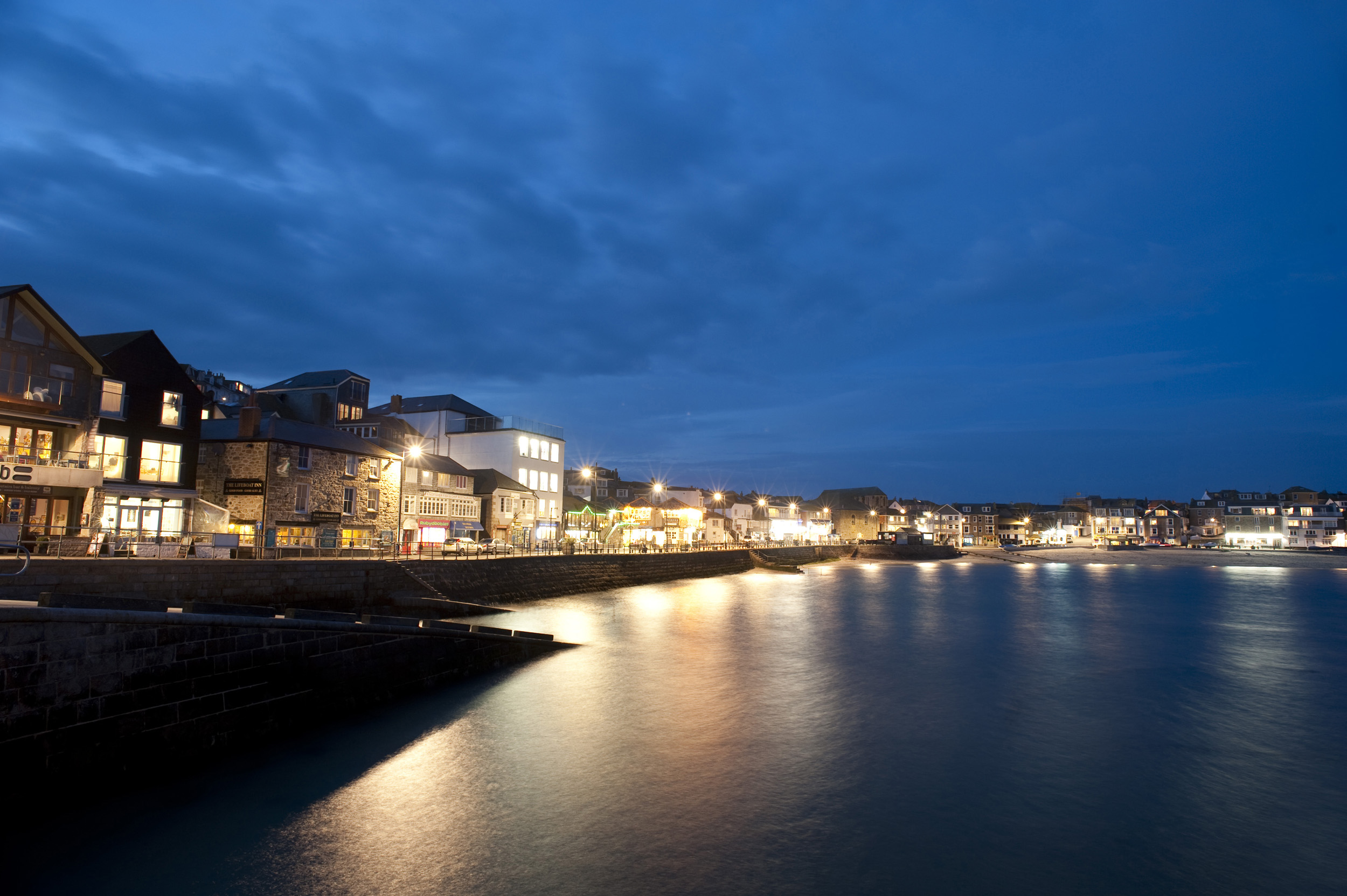 an image of a night time view of the quayside of saint ives harbour, cornwall