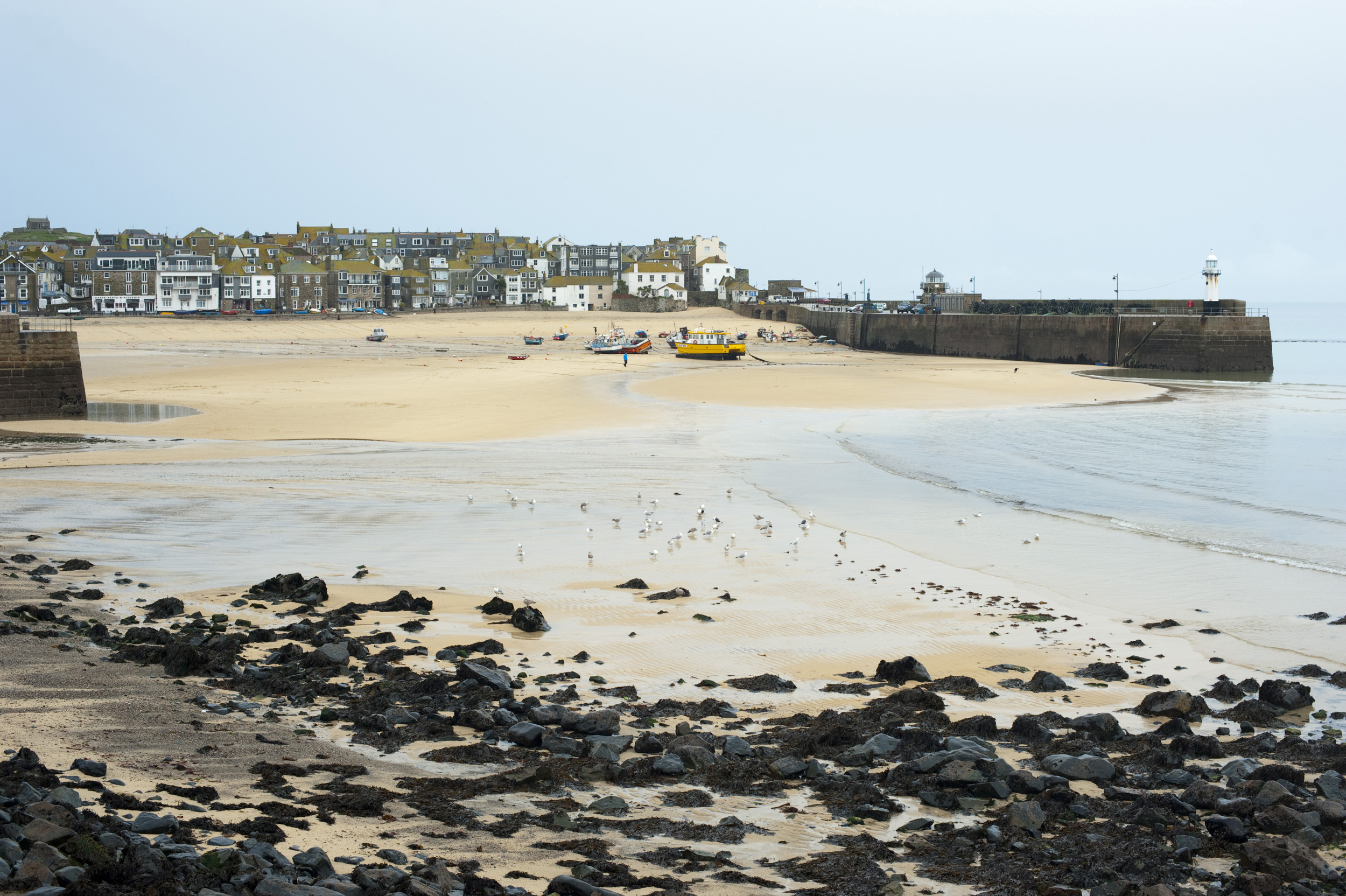 an image of low tide in the harbour at saint ives, cornwall