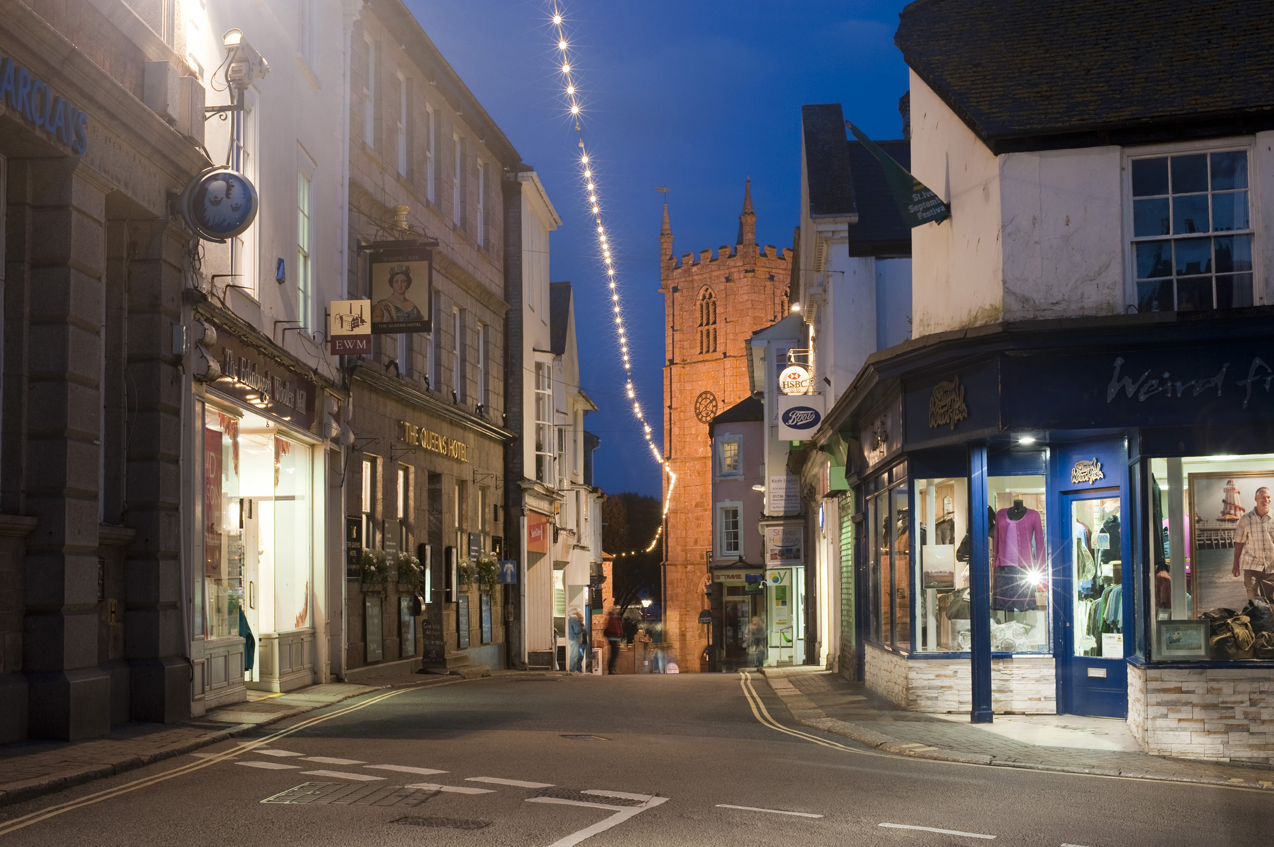 an image of a night time view of the high street in the seaside town of st ives, cornwall