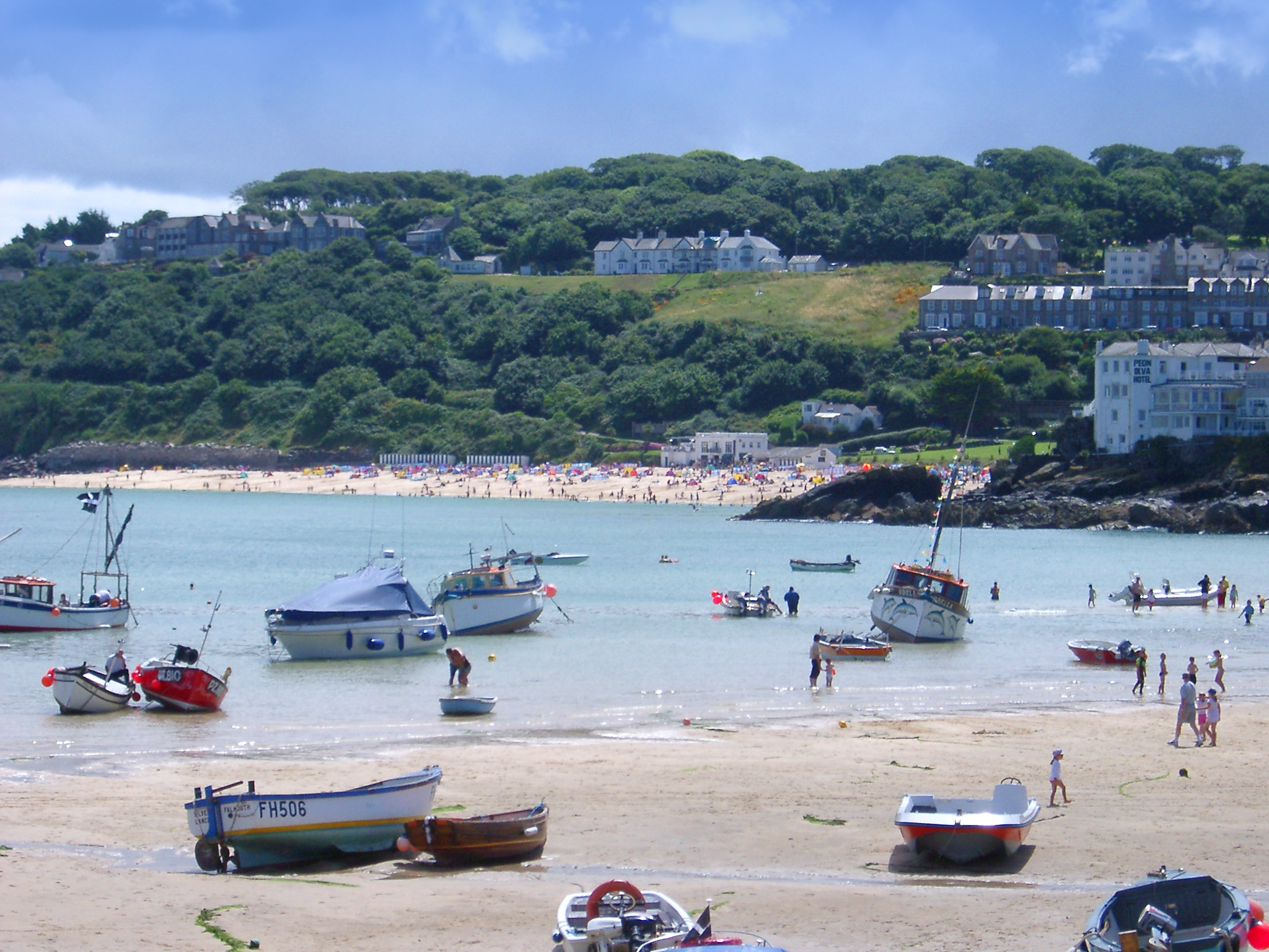 an image of a sunny day at the harbour in st ives, cornwall
