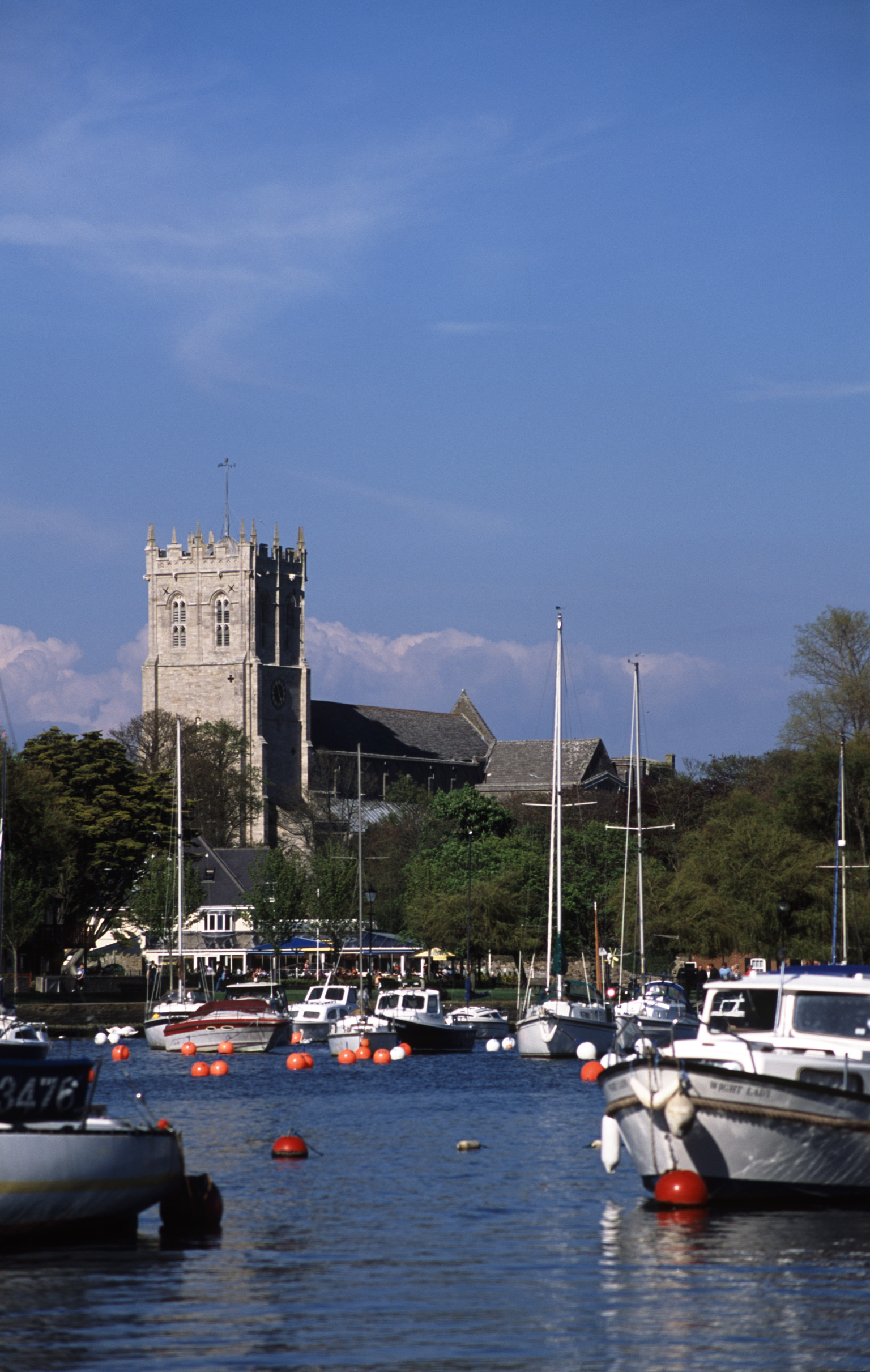 an image of christchurch priory tower and harbour