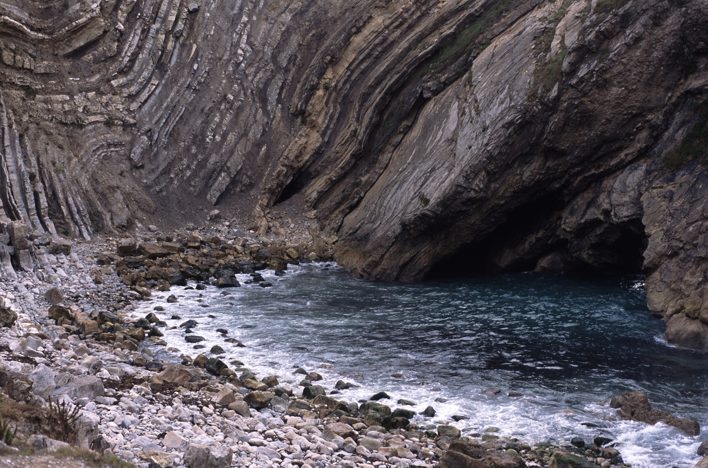 an image of crumpled rock strata, stair hole, lulworth, dorset