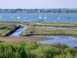 estuary with moored boats around christchurch, dorset