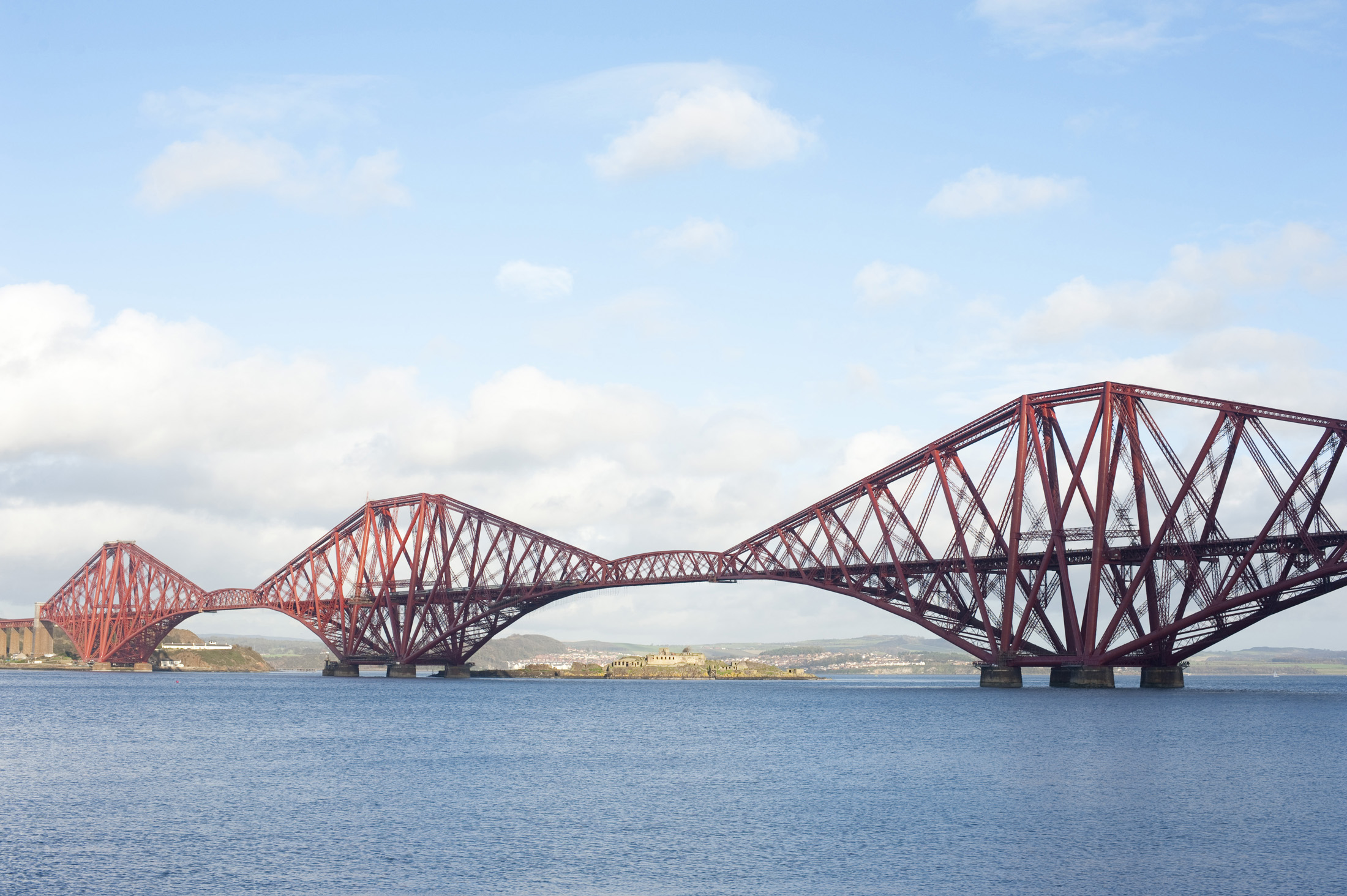 an image of panoramic view of the forth rail bridge crossing the firth of forth, scotland