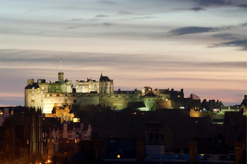 A floodlight view of Edinburgh Castle at twilight