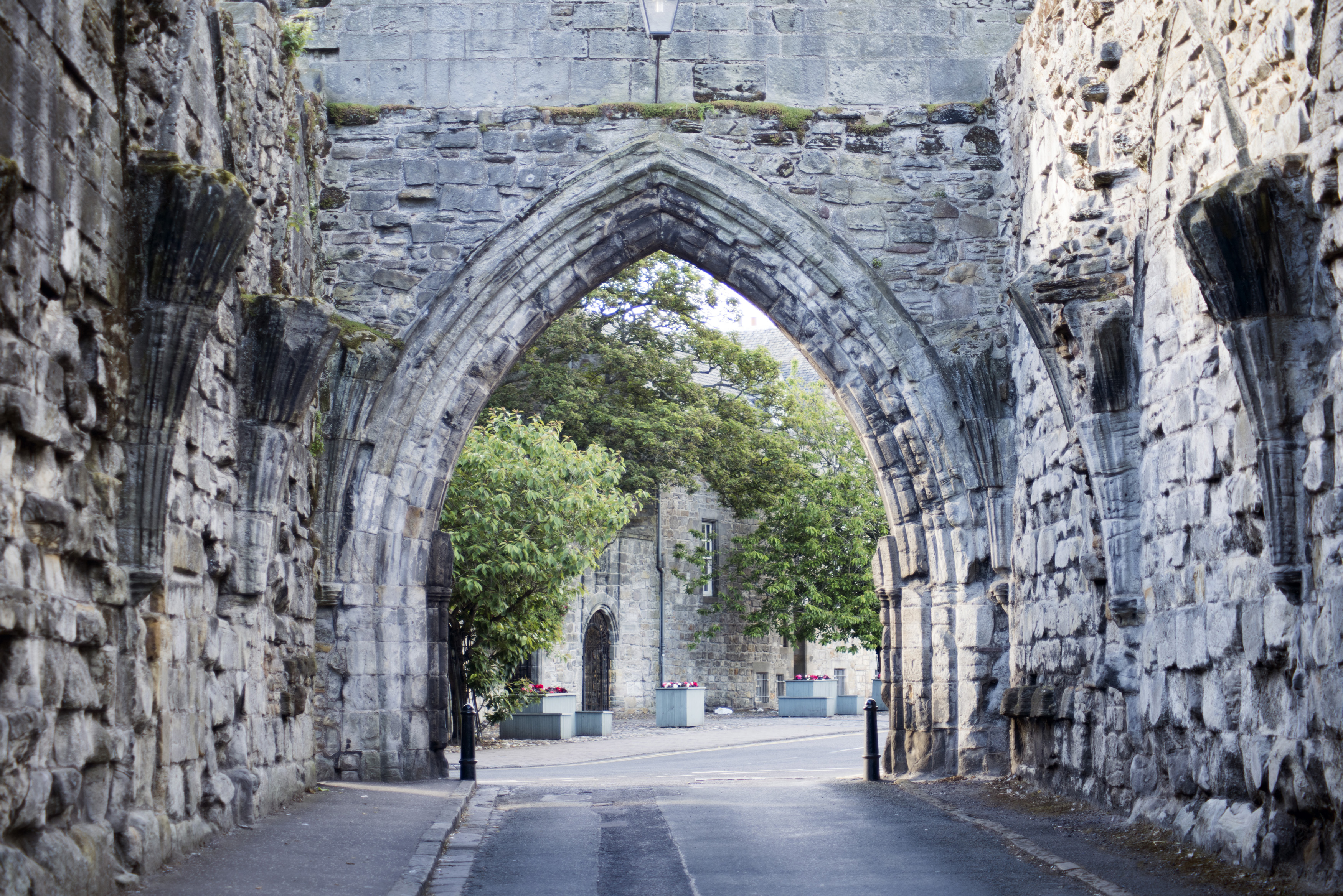 an image of Arched Gothic stone entrance to St Andrews, Fife, Scotland a popular historic tourist attraction