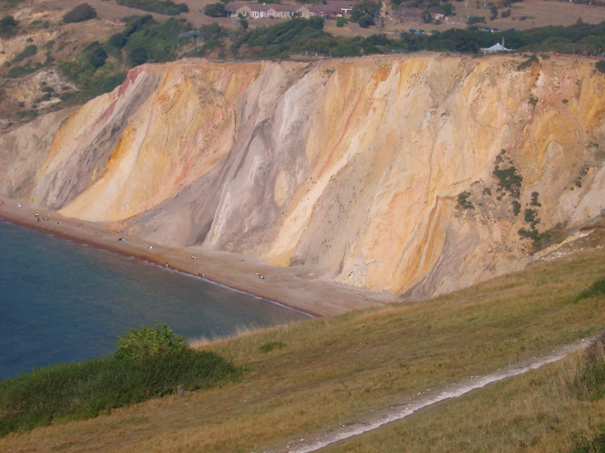 an image of Colorful chalk cliffs eroded by the weather and action of the tides at Alum Bay, Isle of Wight , view from the clifftop
