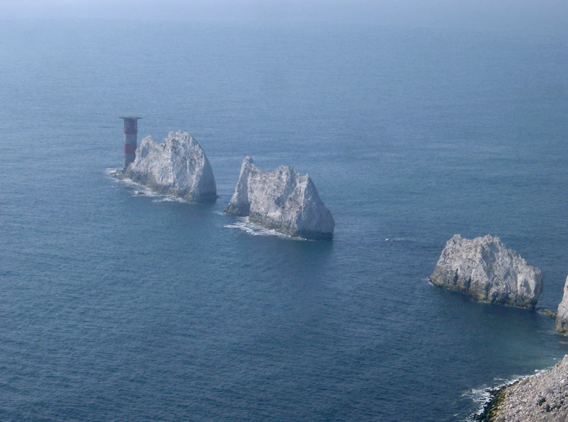 an image of Famous Needles Chalk Rock Formations that rise out of the sea off the western extremity of the Isle of Wight, UK, Close to Alum Bay.