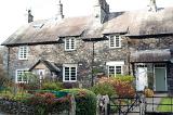 Row of old quaint stone cottages at Skelwith Bridge in the Lake District in Cumbria, an area popular with tourists