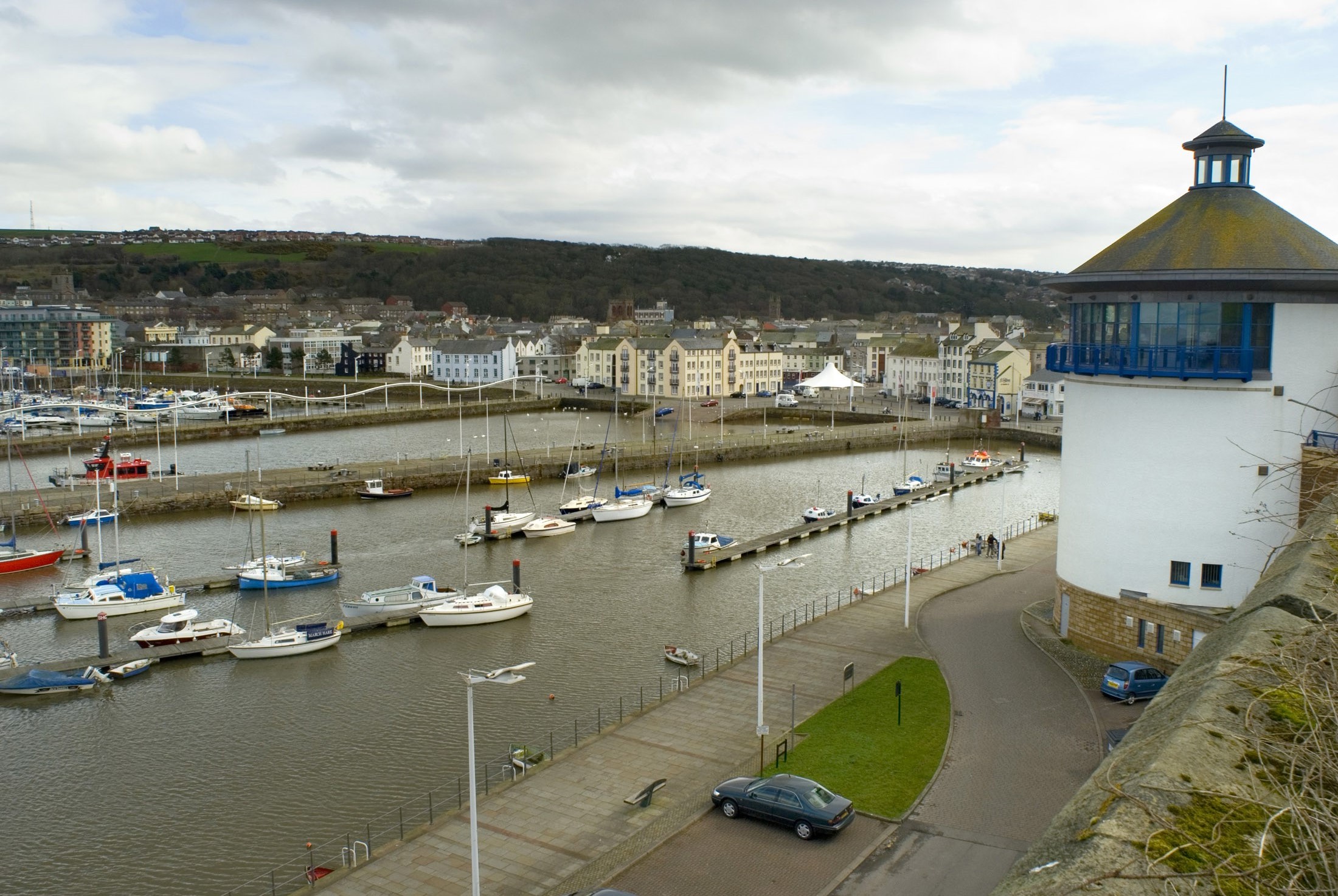 an image of boats in the harbour in whitehaven cumbria viewed from near the beacon museum