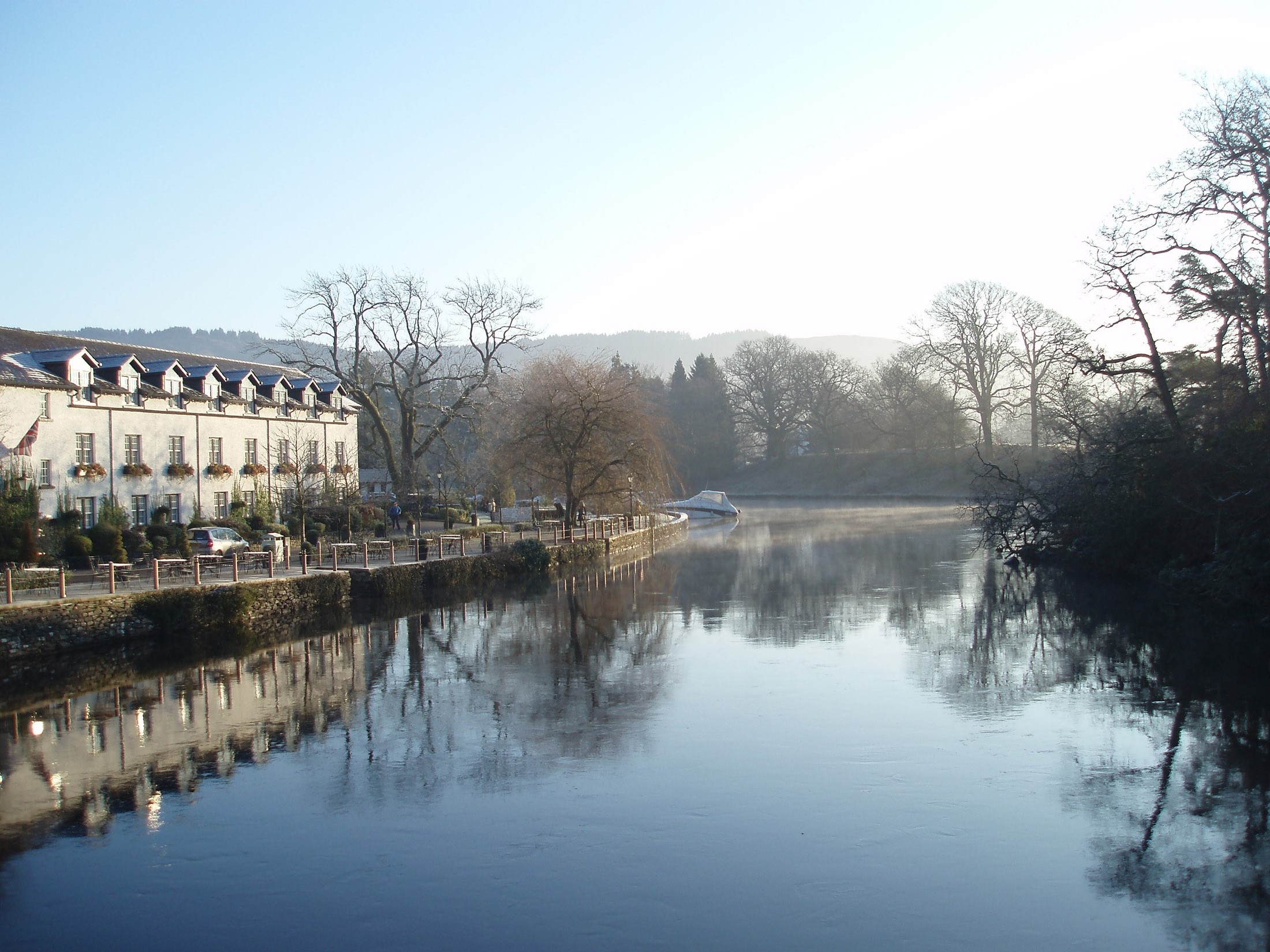 an image of newby bridge swan hotel and windermere on a still winter morning