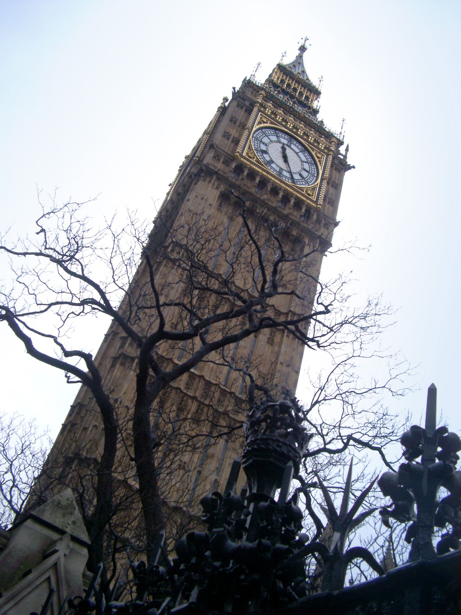 an image of Low angle view looking up the classical Gothic style exterior of the Big Ben clock tower, Westminster, an iconic landmark for London and popular tourist attraction