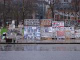Streetside placards in a demonstration in central London on a wet rainy day