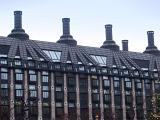 Exterior View of Portcullis House in Westminster, England on Very Light Blue Sky Background.