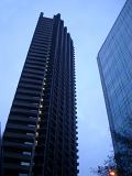Bruralist Architecture, the Towers of Barbican Estate, a Residential Estate in the City of London. Captured from Lower Angle Point with Light Blue Sky Background.