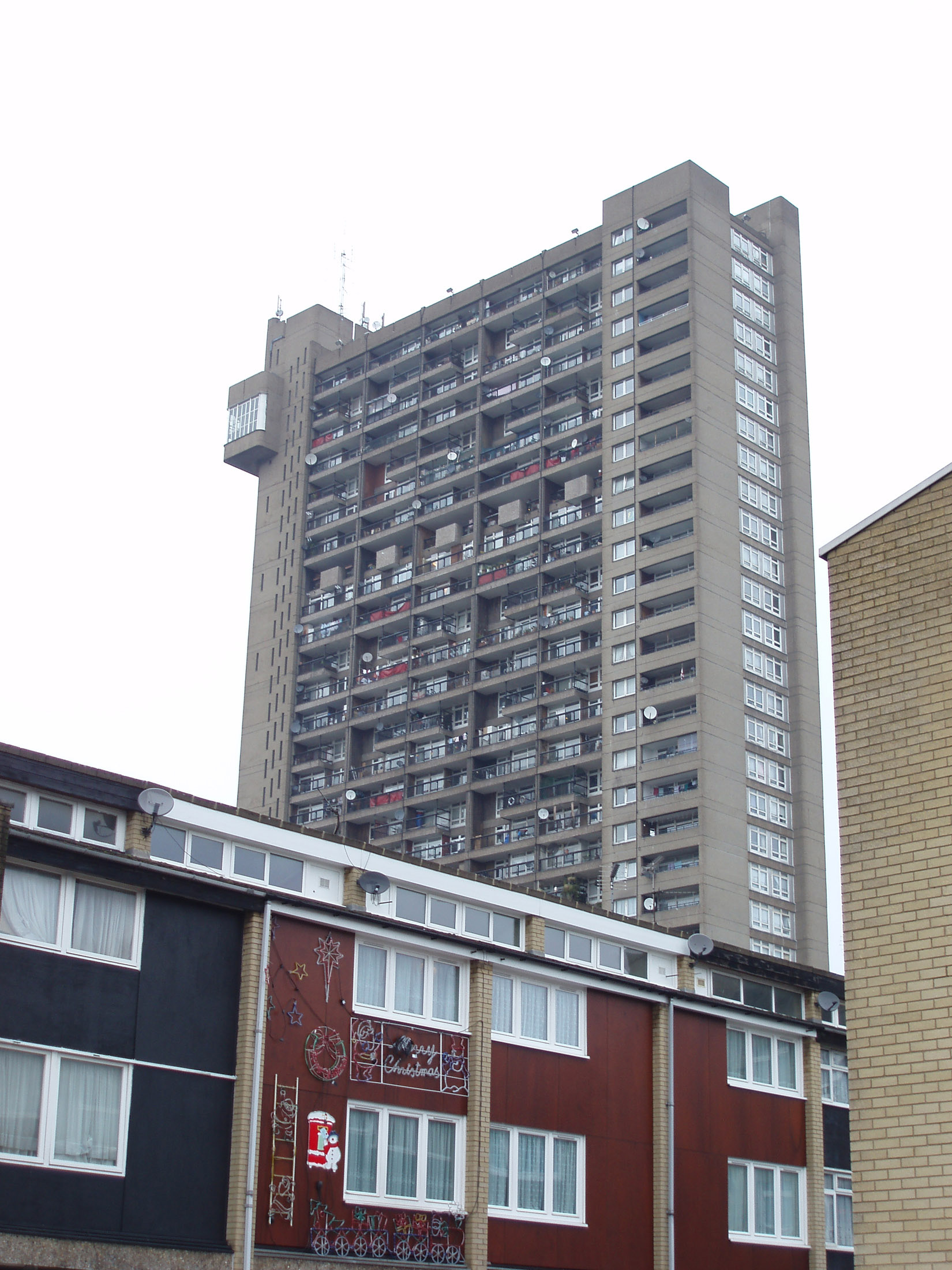 an image of Famous Architectural 31-Storey Building of Trellick Tower in London, England. Captured with White Sky Background.