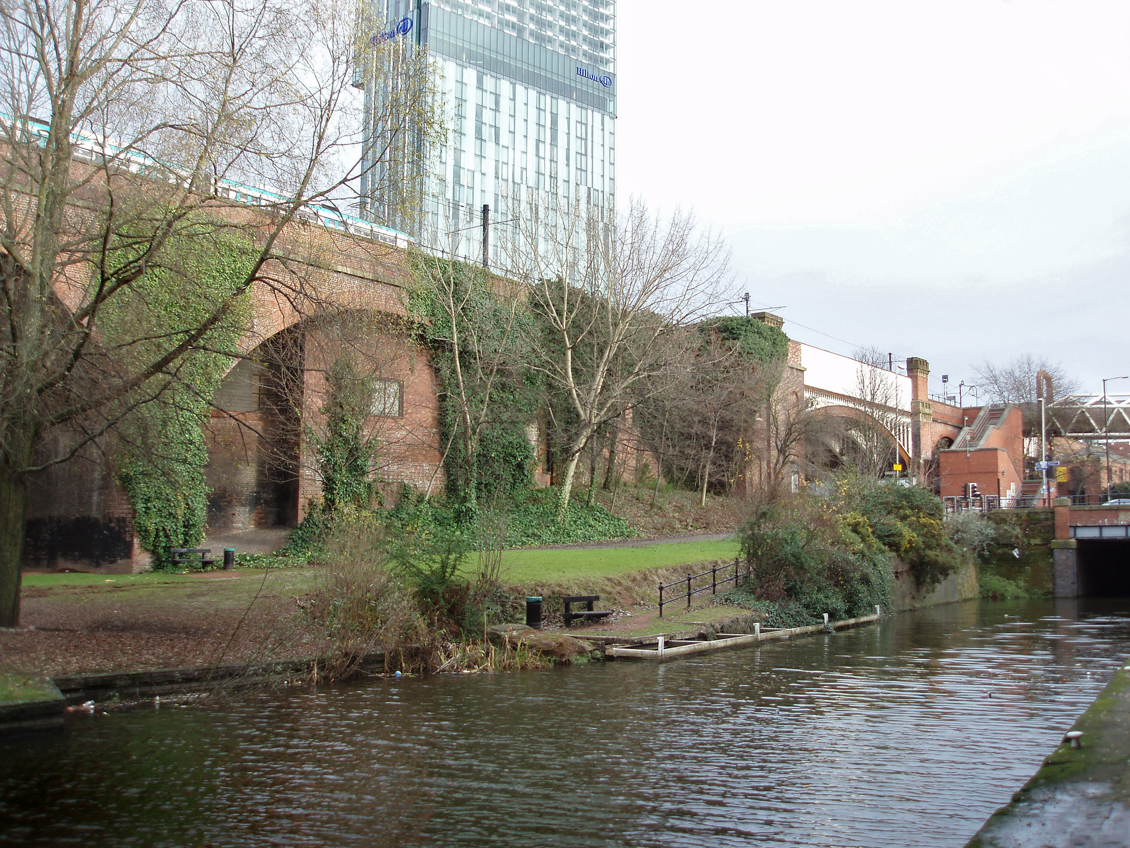 an image of Manchester canal towpath in the Castlefield conservation area in innercity Manchester preserving the first industrial canal and warehouses