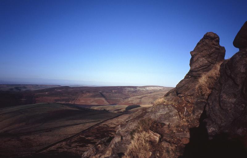 Panorama of Kinder Scout, a moorland plateau and National Nature Reserve n the Dark Peak of the Derbyshire Peak District in England. Captured with Gradient Blue Sky Background.