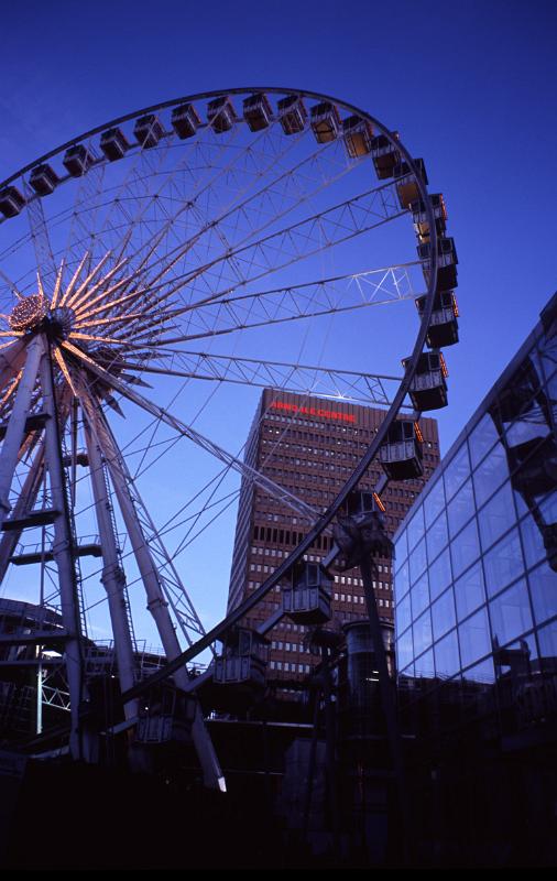 The Manchester Wheel - Famous Transportable Ferris wheel Installation at Piccadilly Gardens, Manchester, England. Captured at Night Time.