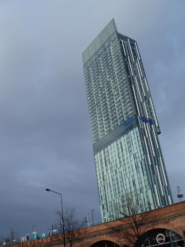 Famous Architectural Beetham Tower, also known as Hilton Tower, a 47-storey mixed-use skyscraper in Manchester, England on Gray Sky Background.