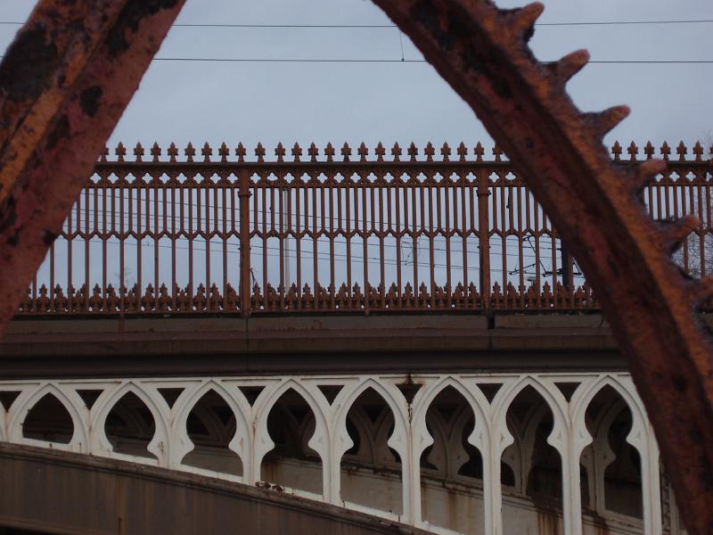 details of an industrial era gear wheel and railway viaduct in manchester castlefields