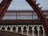 details of an industrial era gear wheel and railway viaduct in manchester castlefields