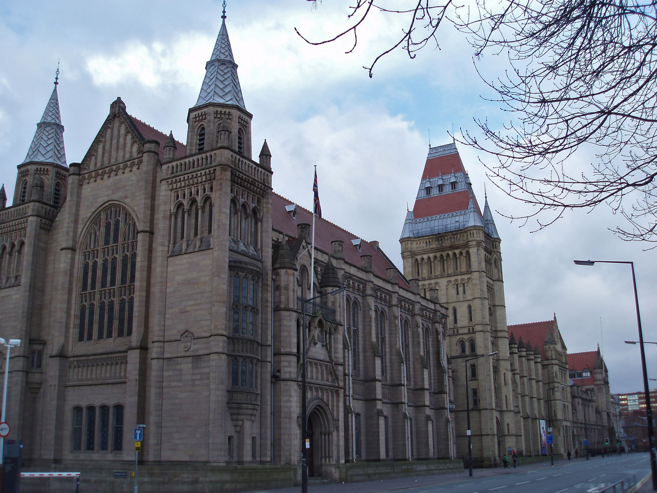 an image of Exterior View of the historic Manchester University Building, a Large Research Center at Manchester, England.