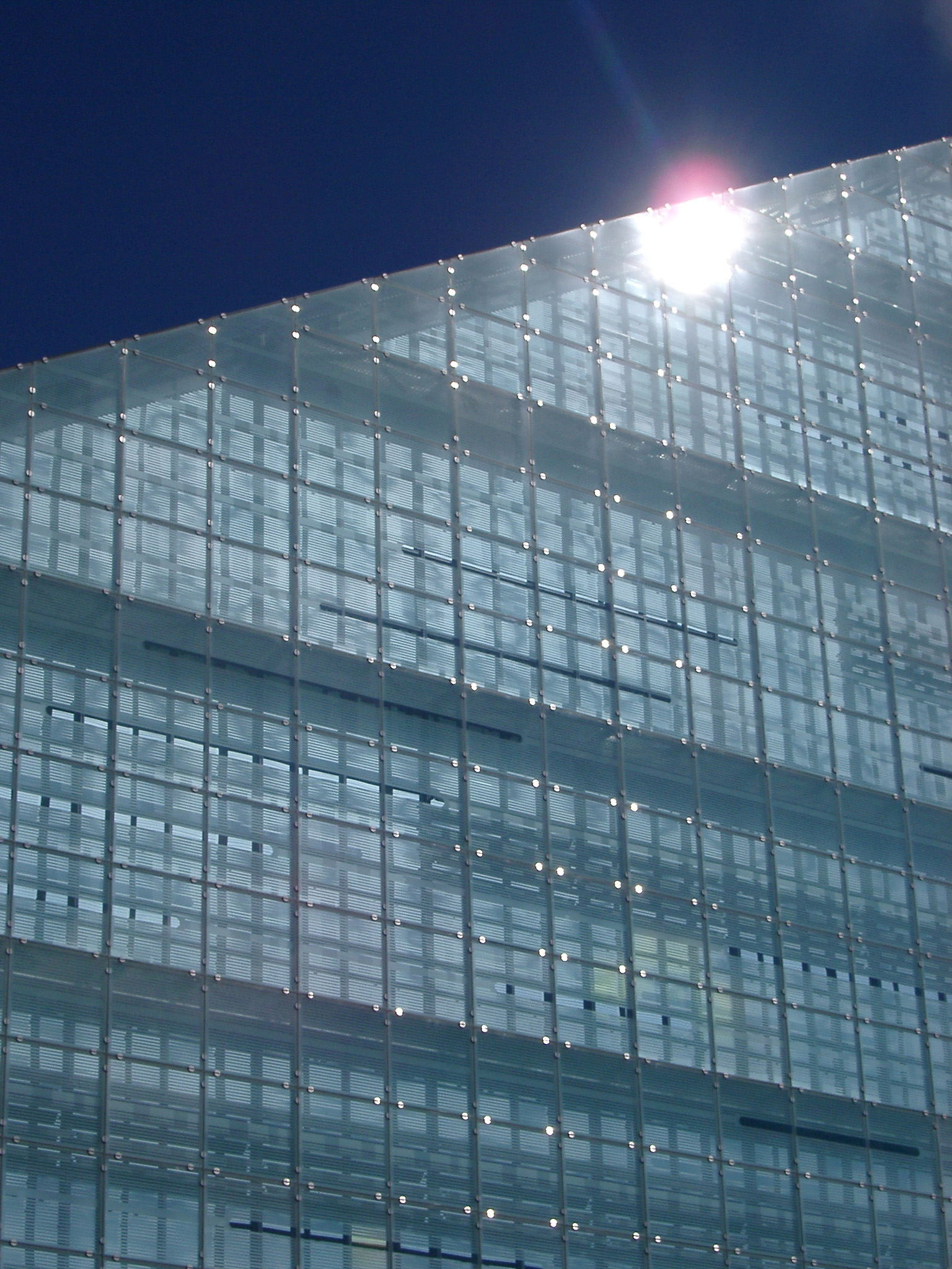 an image of Futuristic glass facade of Urbis, Manchester, an exhibition centre and museum venue in Cathedral Gardens