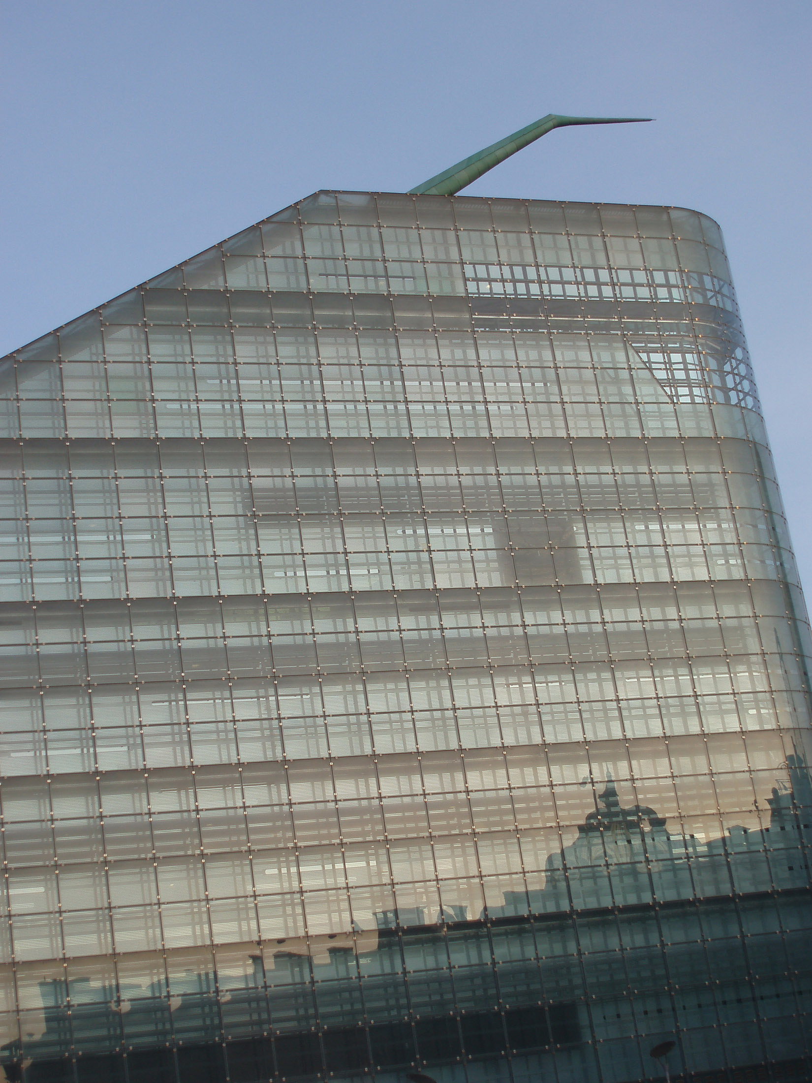 an image of Modern glass exterior of the Urbis building, a futuristic museum and exhibition center in Manchester, Lancashire, UK