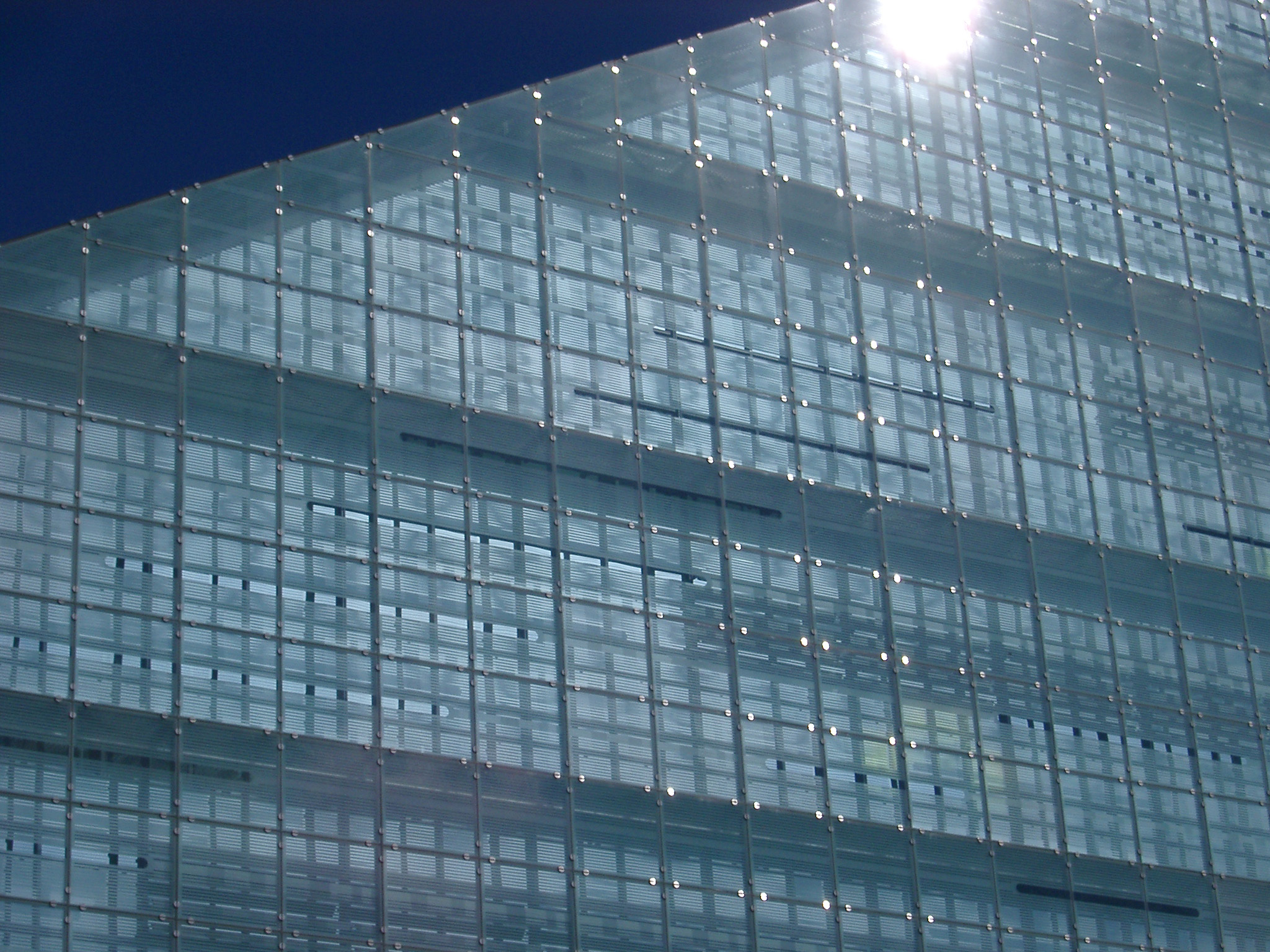 an image of sun glinting off the side of the urbis building in central manchester