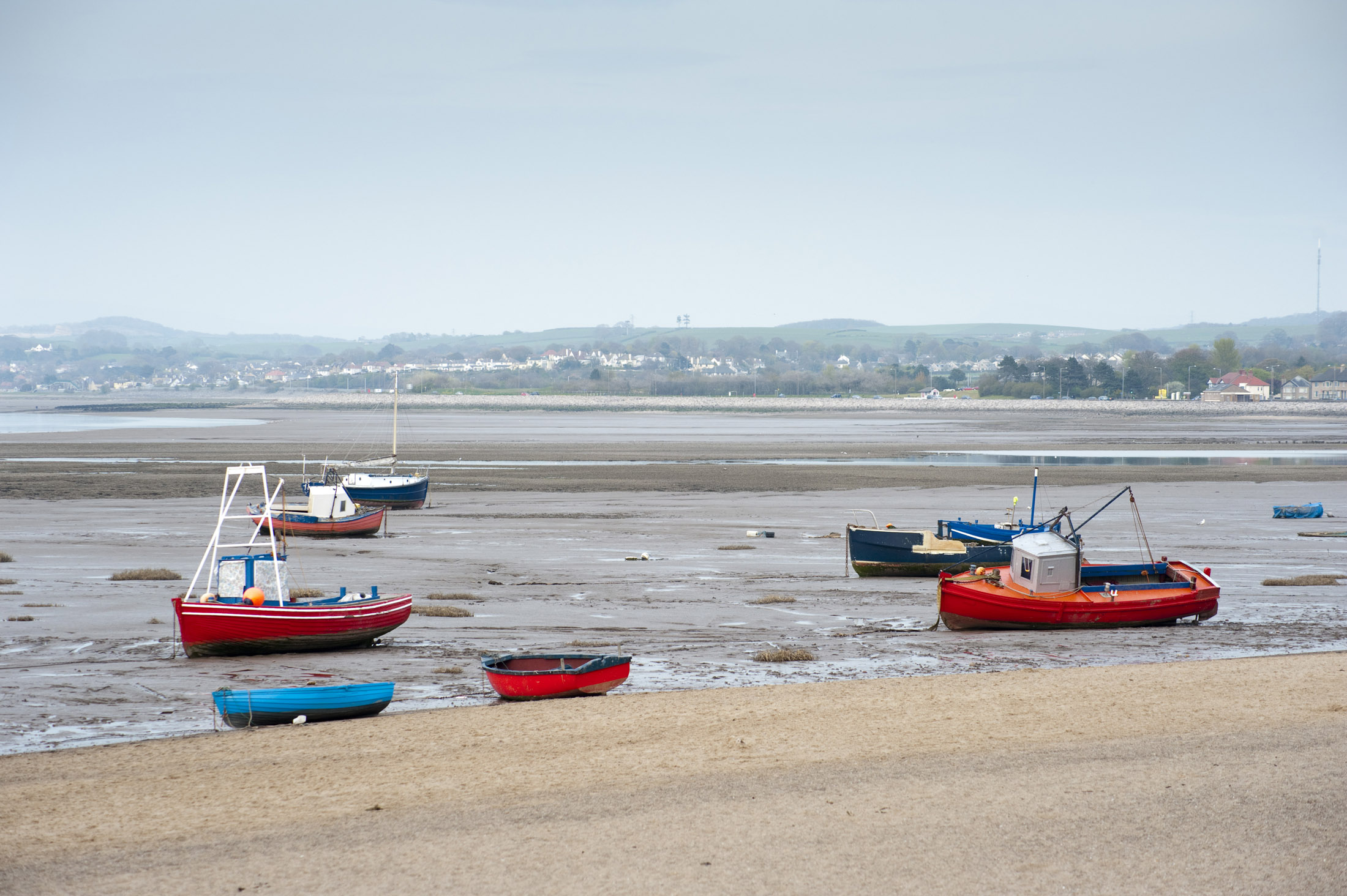 an image of fishing boats at low tide, when the tide goes out in morecambe it goes out a long way, infact the tide has been out since the resorts heyday over 60 years ago