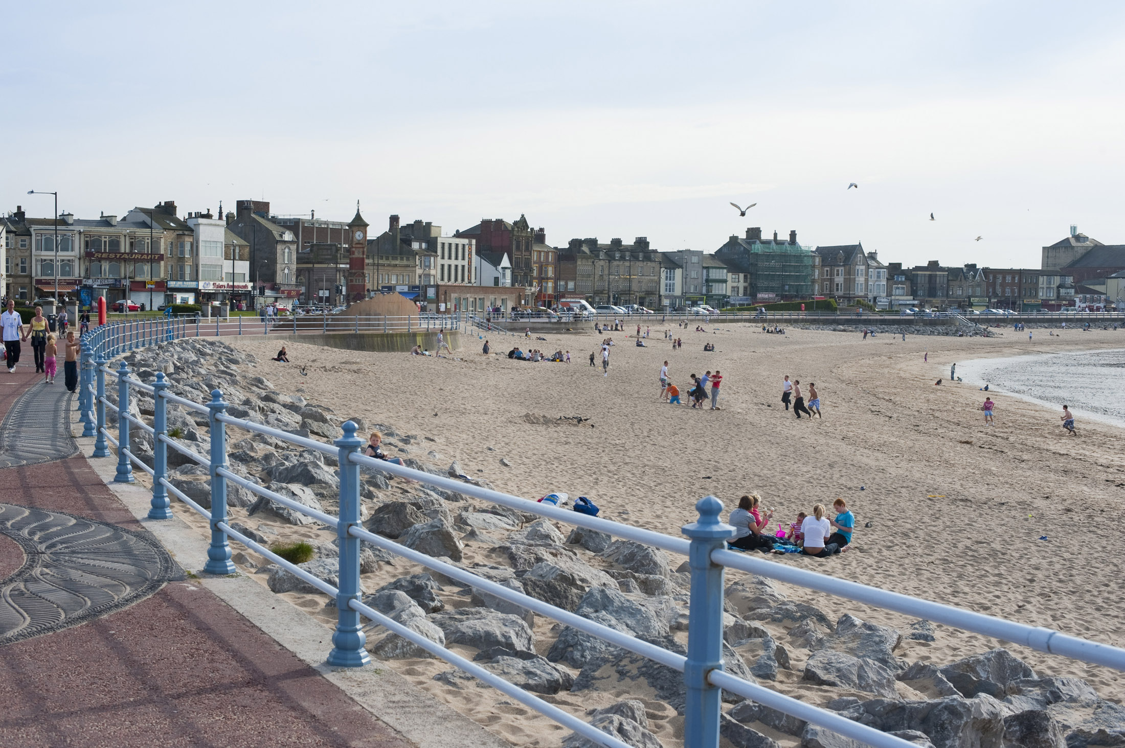 an image of people enjoying (sic) a day on the beach at morecambe