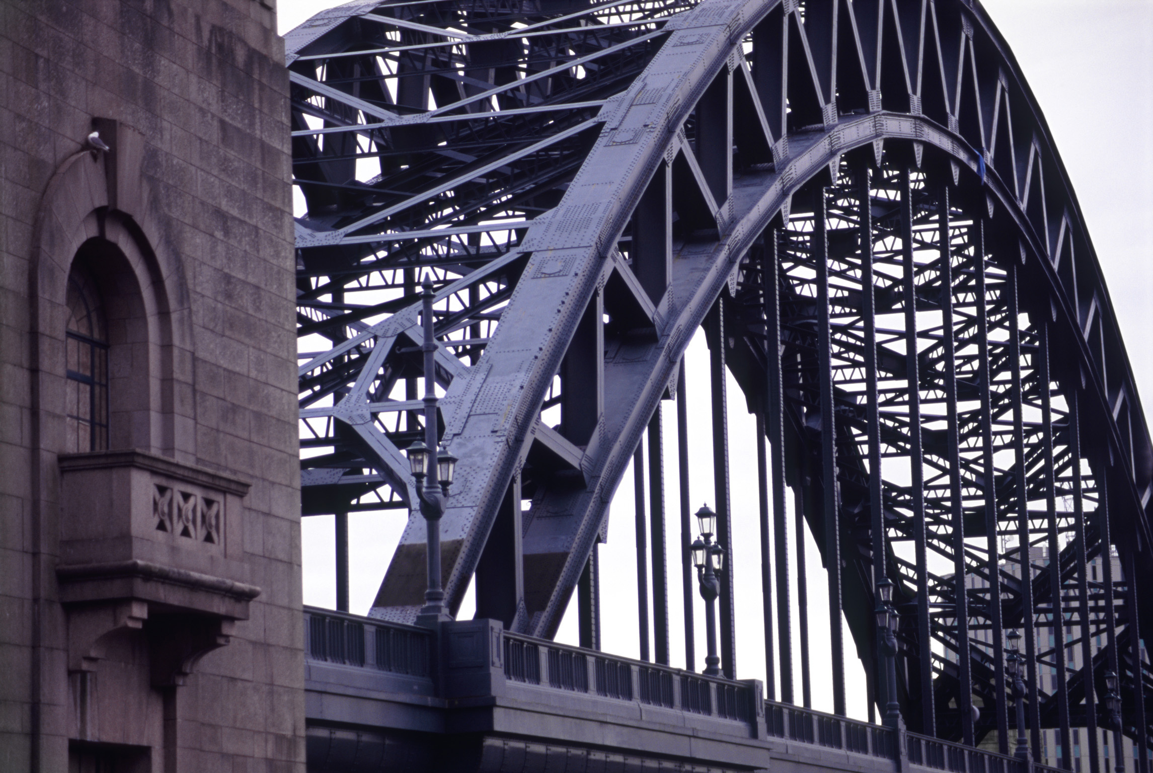 an image of Detail of the steel span and iconic arch on the Tyne Bridge, Newcastle which crosses the River Tyne to connect Gateshead and Newcastle