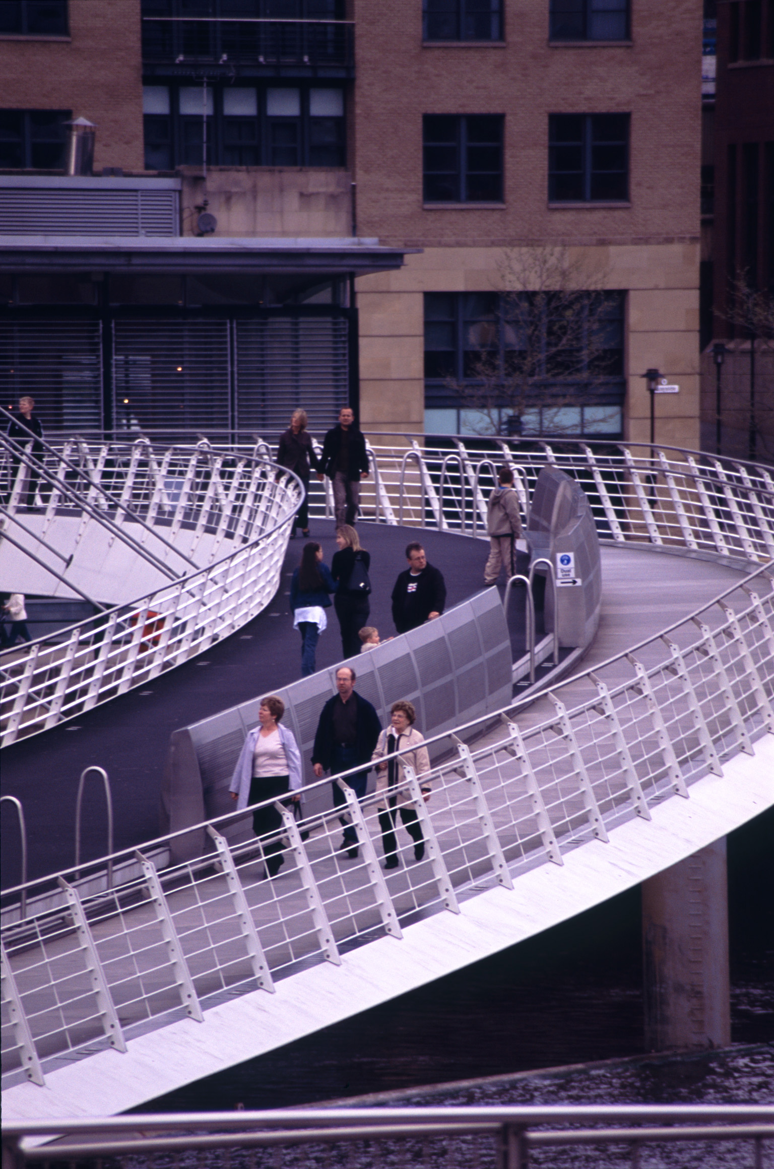 an image of Winking Eye Bridge or The Gateshead Millennium Bridge, a pedestrian and cyclist tilt bridge spanning the River Tyne in England.
